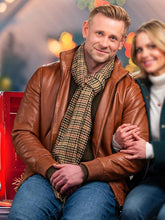 A Christmas Less Traveled 2024 Eric Johnson Brown Jacket